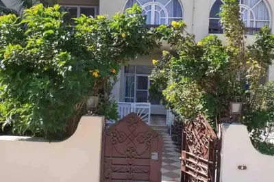 a gate to a house with plants on it at Villa 2 apartment 2 village veiw infront of Palma de Meritee in Hurghada