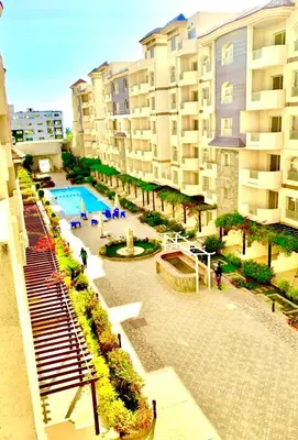 an aerial view of a resort with a pool and buildings at Studio Pool view with balcony Florenza Hurghada in Hurghada