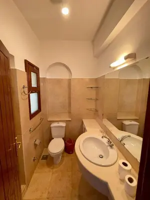 a bathroom with a sink and a toilet and a sink at EL GOUNA Y 97-1-8 WAST GOLF in Hurghada