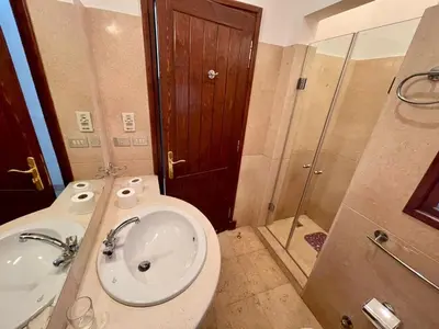 a bathroom with a toilet and a sink and a shower at EL GOUNA Y 97-1-8 WAST GOLF in Hurghada