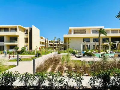 a resort with a swimming pool and a building at A Bright Studio @GCribs - El Gouna W/ Shared pool! in El Gouna
