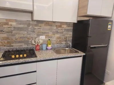 a kitchen with a sink and a refrigerator at Makramia New Studio near to the beach in Hurghada