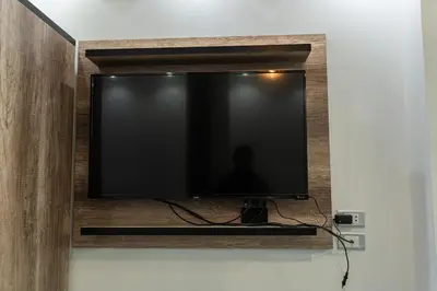 a flat screen tv hanging on a wall at Juliana Beach Hurghada in Hurghada