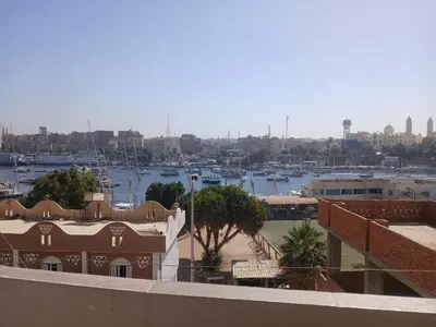 a view of a harbor from the roof of a building at Ezzo Nubian guest house in Aswan