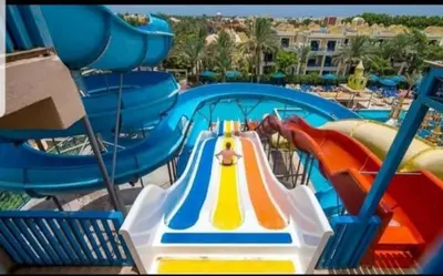 a slide in a water park with a water park at Mirage Aqua Resort 2 Bedroom Apartment in Hurghada