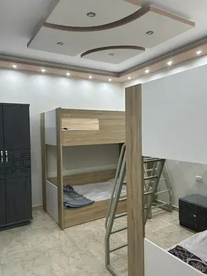 a room with a bunk bed with a ceiling at Mirage Aqua Resort 2 Bedroom Apartment in Hurghada