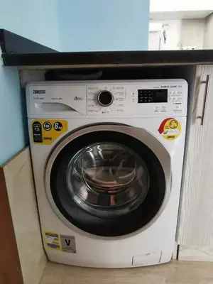 a white washing machine sitting in a kitchen at Schöne Europäische 3 Zimmer Wohnung in Al Dahar in Hurghada