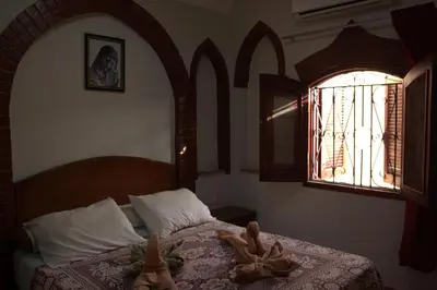 a bedroom with a bed and a window at Mogran Guest House in Luxor