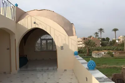 an entry to a building with an archway at Mogran Guest House in Luxor