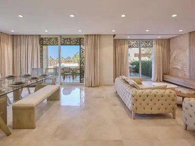 a living room with a couch and a table at Boutique Residence Mangroovy-Lemon Spaces Gouna in Hurghada