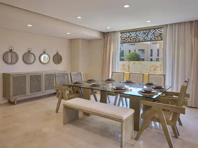 a dining room with a table and chairs and a window at Boutique Residence Mangroovy-Lemon Spaces Gouna in Hurghada