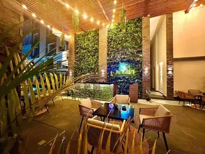 a lobby with a table and chairs and plants at Imperial Resort Hurghada-The Hurghada Hideaway in Hurghada
