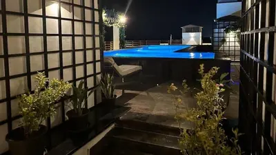 a patio with a swimming pool at night at Imperial Resort Hurghada-The Hurghada Hideaway in Hurghada