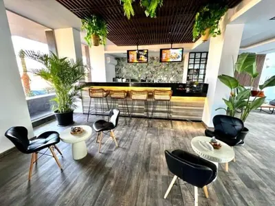 a restaurant with chairs and a bar with plants at Imperial Resort Hurghada-The Hurghada Hideaway in Hurghada