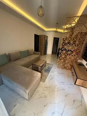 a living room with a couch and a table at Juliana resort beach - Julia apartment in Hurghada