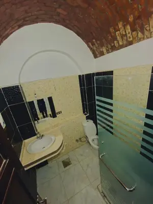 a bathroom with a sink and a toilet at king kassem nubian guest house in Aswan