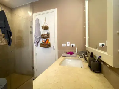 a bathroom with a sink and a mirror at 1-Bedroom Apartment in Joubal with nice Pool in Hurghada