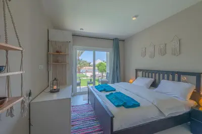 a bedroom with a large bed and a window at 1-Bedroom Apartment in Joubal with nice Pool in Hurghada