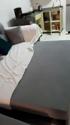 a bed sitting in a living room with at Turtles beach resort hourghada studio view sea view pool private beach jacuzzi security air-conditioned Cafe restaurant on the beach and a large sunny balcony in Hurghada