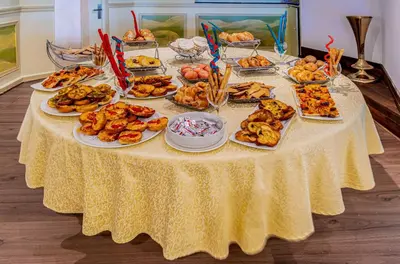 a table with plates of food on top of it at Sonesta Moon Goddess Cruise Ship From Luxor to Aswan - 04 & 07 nights Every Monday in Luxor