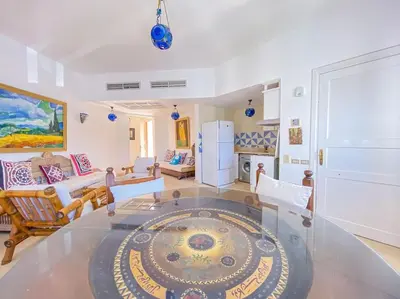 a large living room with a large rug on the floor at 1-Bedroom Apartment in Abu Tig Marina + Roof Top in Hurghada