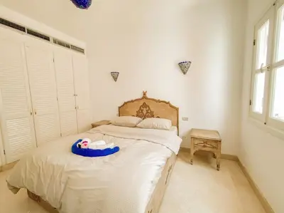 a bedroom with a bed with a toy on it at 1-Bedroom Apartment in Abu Tig Marina + Roof Top in Hurghada