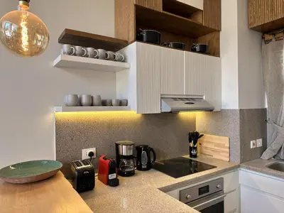 a kitchen with white cabinets and a counter top at Charming 3BR Villa/Free Pool & Lagoon Access@Gouna in Hurghada