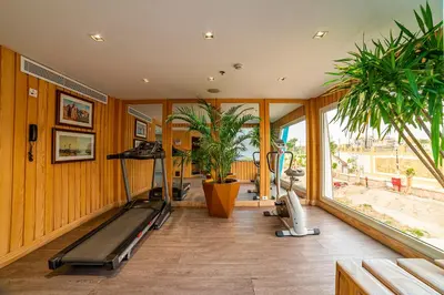a room with a gym with a treadmill and plants at Sonesta Sun Goddess Cruise Ship From Luxor to Aswan - 04 & 07 nights Every Monday in Luxor
