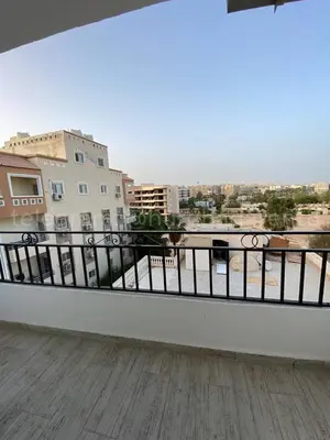 a balcony with a view of a city at Makramia 2 bedroom apartment in Hurghada