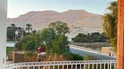 a view of a road with mountains in the background at Amenhotep Apartments in Luxor