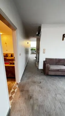 a living room with a couch and a living room at Amenhotep Apartments in Luxor