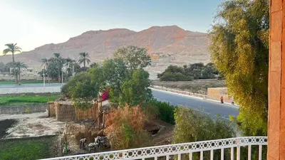 a view of a road with mountains in the background at Amenhotep Apartments in Luxor