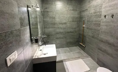 a bathroom with a sink and a shower at Imperial Resort Apartment XL 1 Bed in Hurghada