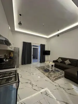 a living room with a couch and a table at Al Baba Nile Villa in Luxor