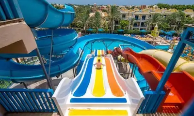 a ride in a water park with a slide at شاليه داخل ميراج اكوا بارك عائلات فقط غير مخصص للشباب in Hurghada