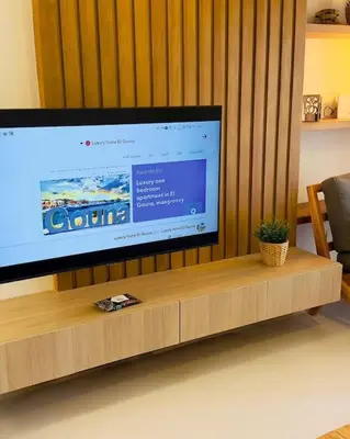 a large flat screen tv sitting on top of a table at Cozy 3 bedrooms in swan lake in Hurghada
