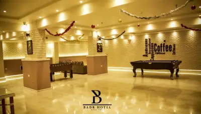 a pool table in a room with a ping pong ball at Badr Hotel & Resort El Kharga in Kharga