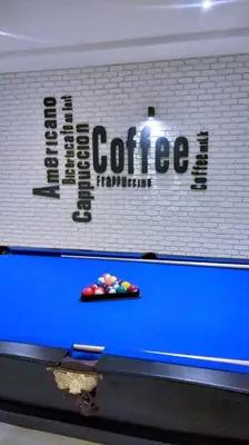 a sign for a coffee shop on a wall at Badr Hotel & Resort El Kharga in Kharga