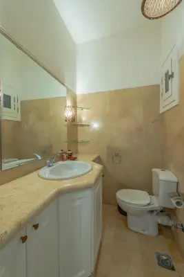 a bathroom with a sink and a toilet at Stunning poolhouse duplex - 3 bedrooms - South Marina - El Gouna in Hurghada