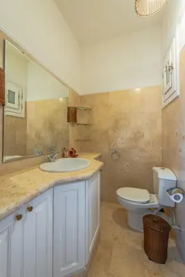 a bathroom with a sink and a toilet at Stunning poolhouse duplex - 3 bedrooms - South Marina - El Gouna in Hurghada