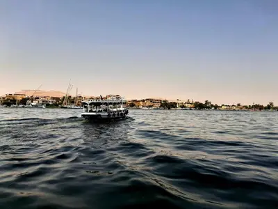 a boat on a body of water at Alam B&B Luxor in Luxor
