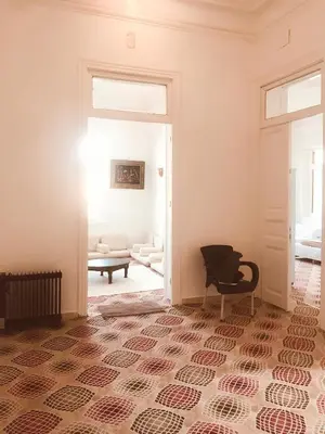 a room with a door open to a living room at Alam B&B Luxor in Luxor
