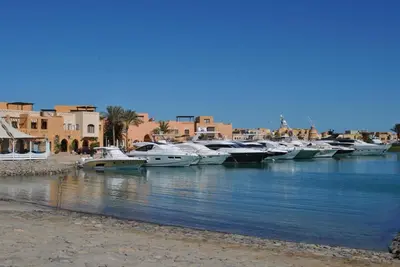 a group of boats are docked in a river at Modernes Apartment in El Gouna - South Marina in El Gouna