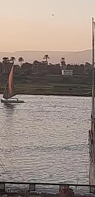 a sail boat in a body of water at Nille and Garden View Apartment in Jazīrat al ‘Awwāmīyah