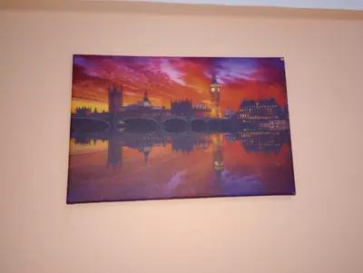 a picture of a painting on a wall at ALHASANI APARTMENT in Hurghada