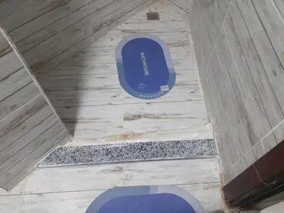 an overhead view of a blue toilet in a room at Kazpilkna Beach Neighborhoods in Hurghada
