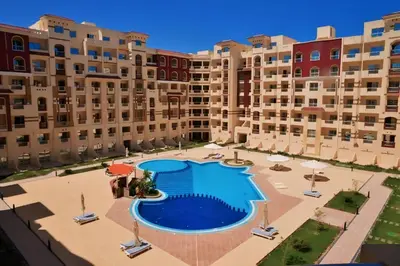 an aerial view of an apartment complex with a swimming pool at Florenza Khamsin Resort Hurghada in Hurghada