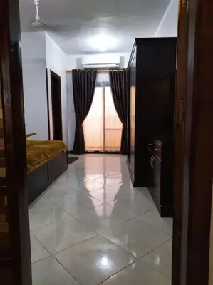 a room with a bedroom with a bed and a window at El Minaa Residents 5 in Luxor