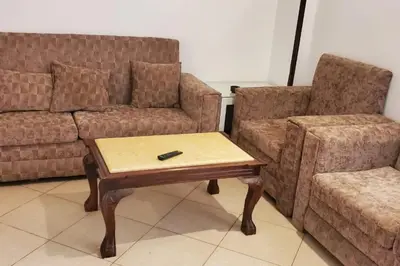 a living room with a couch and a coffee table at Elminaa Residents 3 in Luxor
