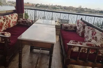 a living room with a couch and a table at Elminaa Residents 3 in Luxor